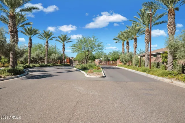 a view of a street with a building in the background