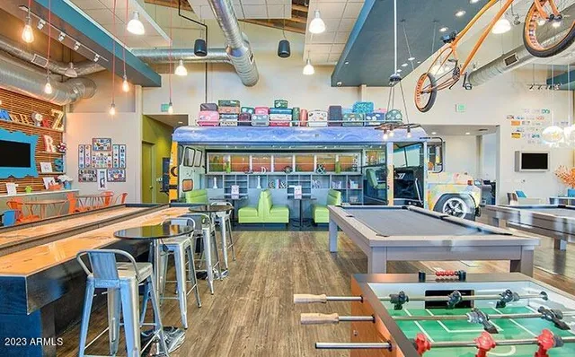 a front view of a house with potted plants