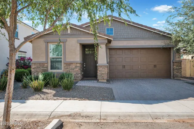 a front view of a house with garage