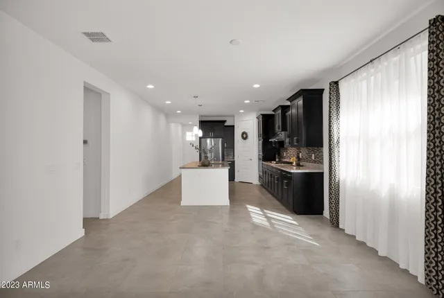 a kitchen with stainless steel appliances a refrigerator sink and stove