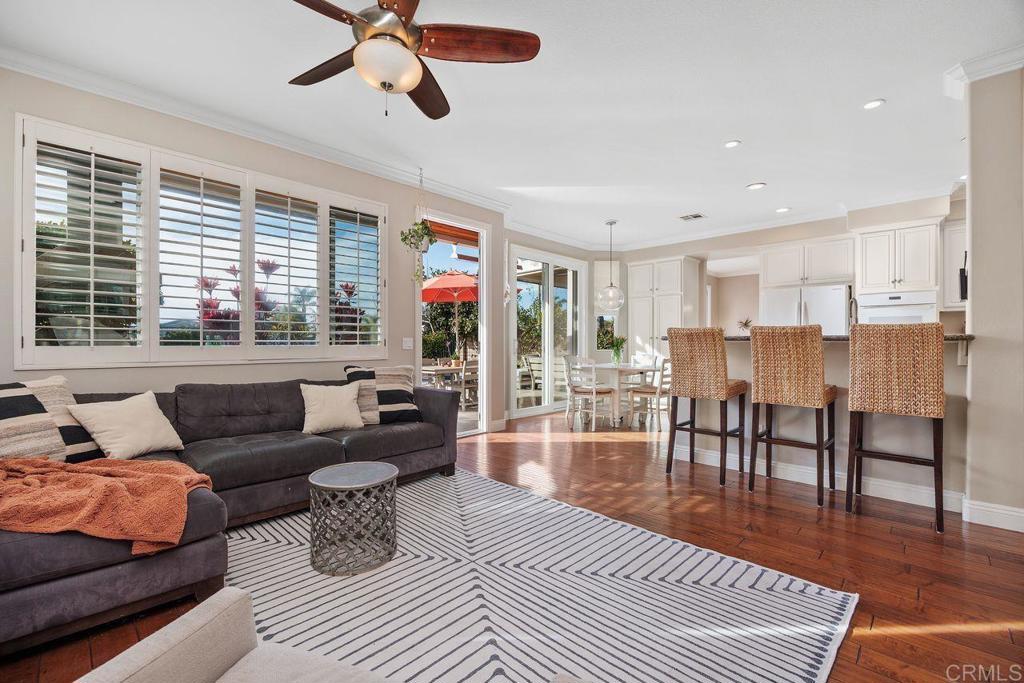 6707 Blue Point Drive Carlsbad, CA 92011 - Photo 14 of 43 a living room with furniture and a wooden floor