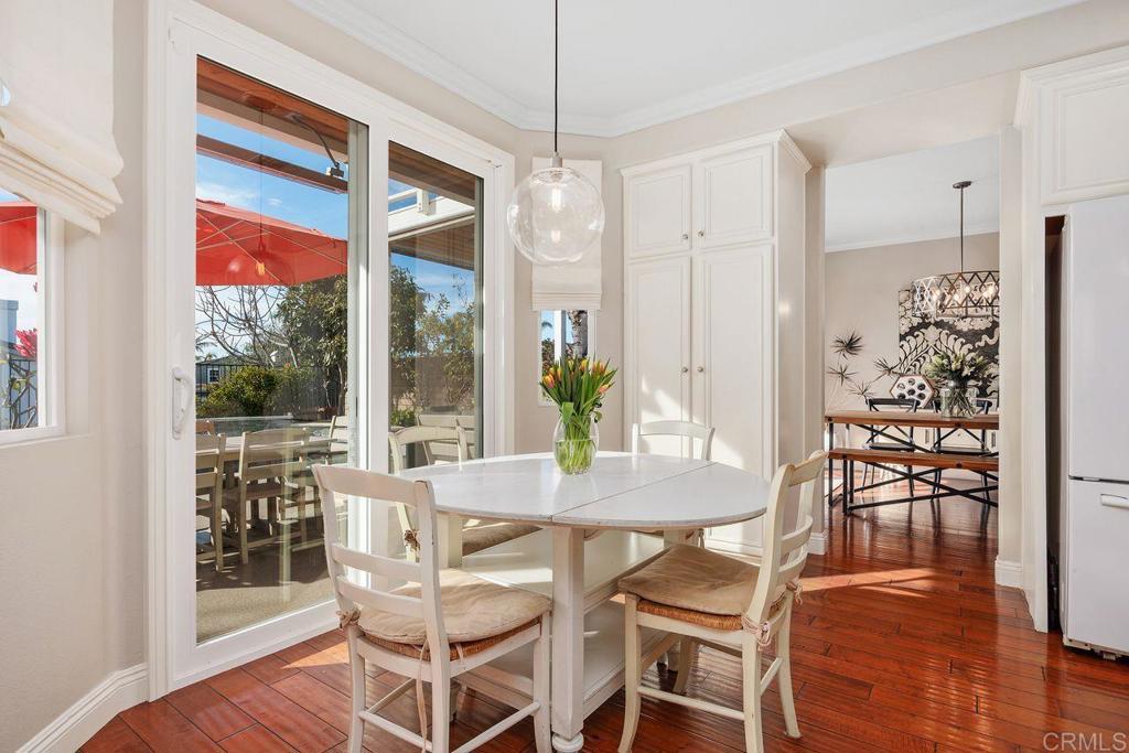 6707 Blue Point Drive Carlsbad, CA 92011 - Photo 15 of 43 a dining room with furniture window wooden floor