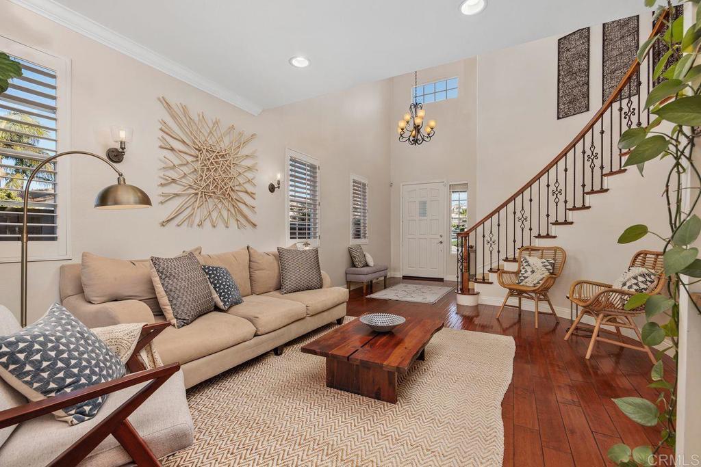 6707 Blue Point Drive Carlsbad, CA 92011 - Photo 23 of 43 a living room with furniture and wooden floor