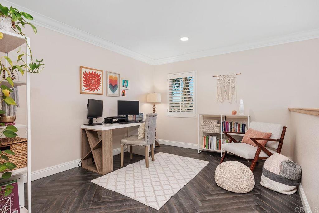 6707 Blue Point Drive Carlsbad, CA 92011 - Photo 24 of 43 a living room with furniture a rug and a table