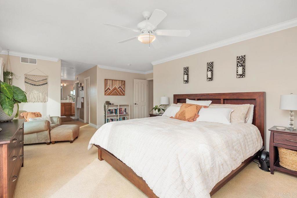 6707 Blue Point Drive Carlsbad, CA 92011 - Photo 30 of 43 a spacious bedroom with a bed and a couch