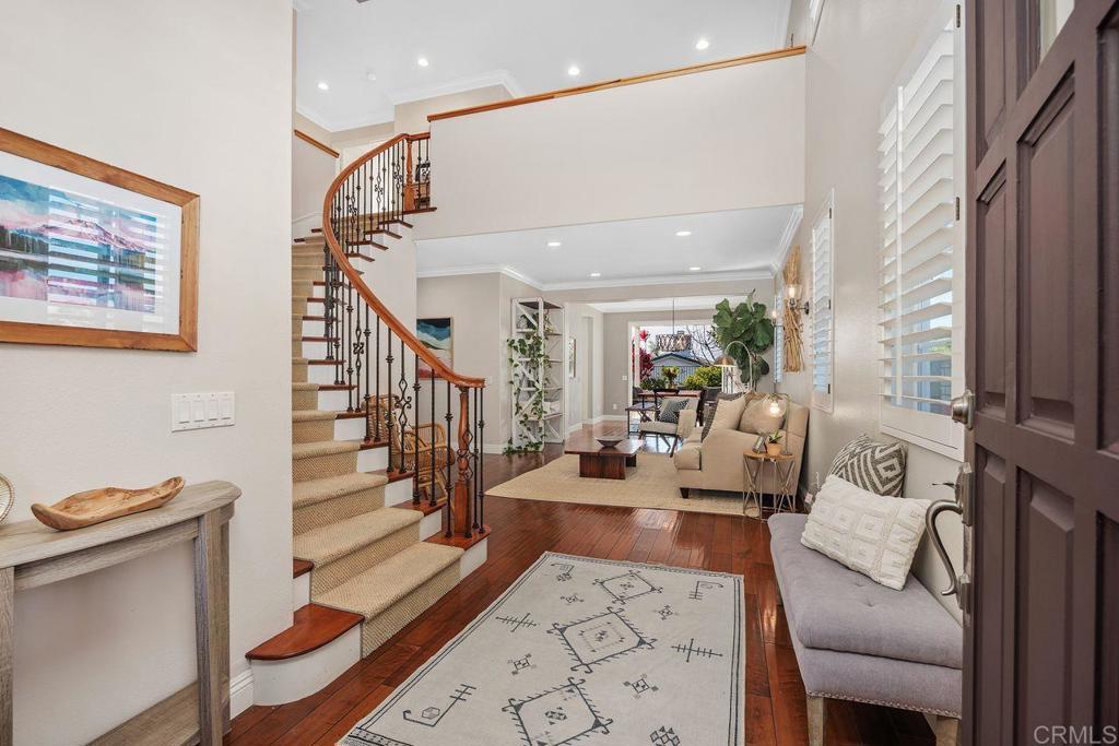 6707 Blue Point Drive Carlsbad, CA 92011 - Photo 3 of 43 a living room with furniture and wooden floor