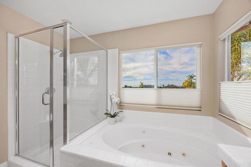 6707 Blue Point Drive Carlsbad, CA 92011 - Photo 32 of 43 a bathroom with a bathtub and a shower