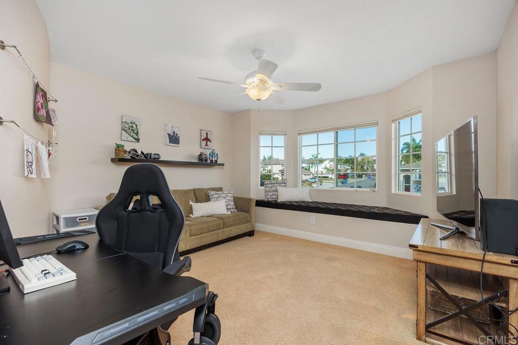 6707 Blue Point Drive Carlsbad, CA 92011 - Photo 33 of 43 a living room with furniture and a large window