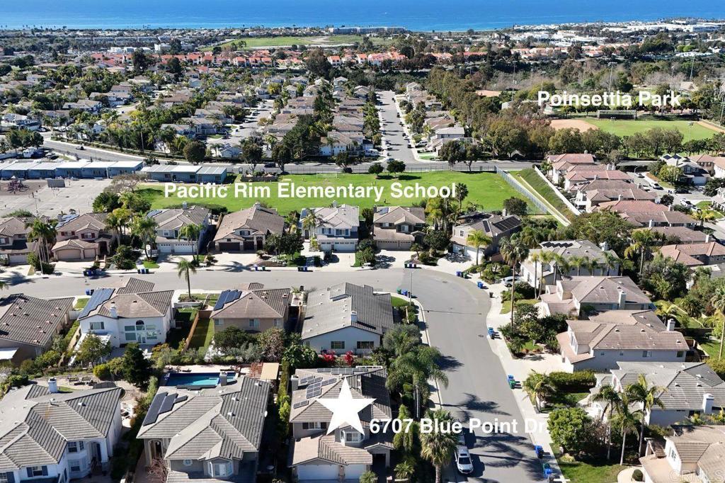 6707 Blue Point Drive Carlsbad, CA 92011 - Photo 38 of 43 an aerial view of a city with lots of residential buildings ocean and mountain view in back