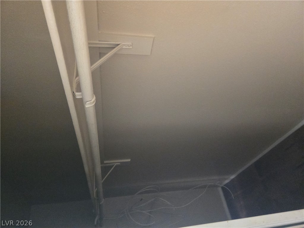 7200 West Pirates Cove Road, Unit 2047 Las Vegas, NV 89145 - Photo 9 of 17 An essential utility space offering straightforward access and functional overhead installations.