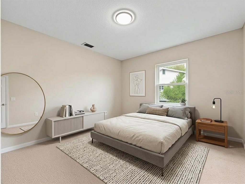 2733 Middle Street Orlando, FL 32807 - Photo 14 of 23 a bedroom with a bed and window