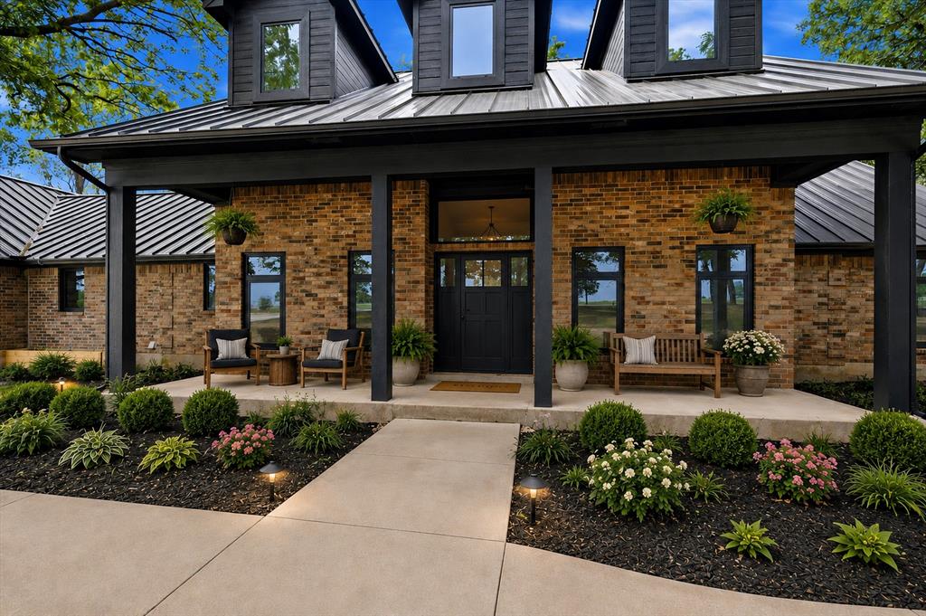 410 Arkansas Road Sadler, TX 76264 - Photo 4 of 40 a view of a house with potted plants