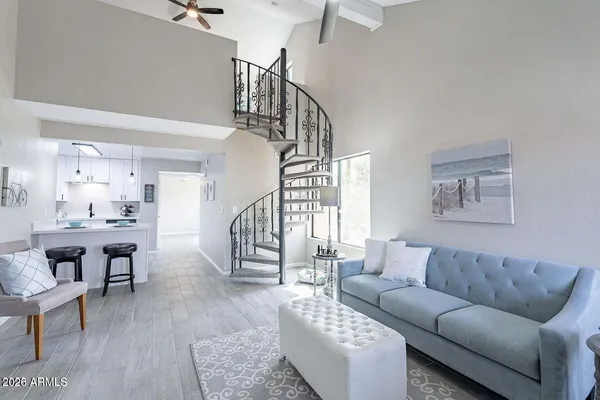 a view of kitchen with microwave and cabinets