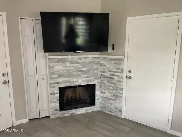 a kitchen with a sink and a fireplace