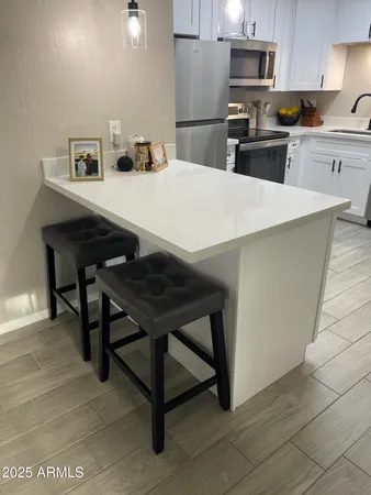 a kitchen with a stove and a refrigerator