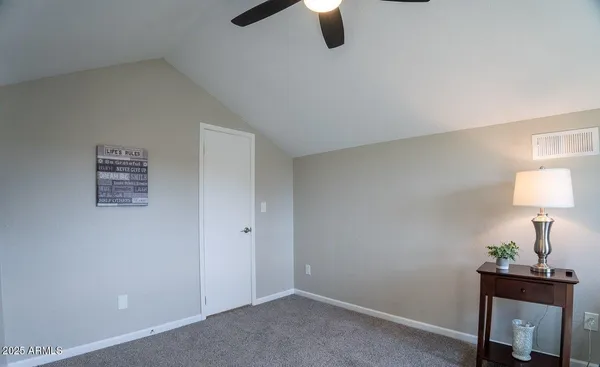 a view of a grassy field with sitting area