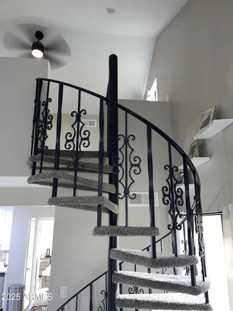 a large kitchen with kitchen island a dining table and chairs