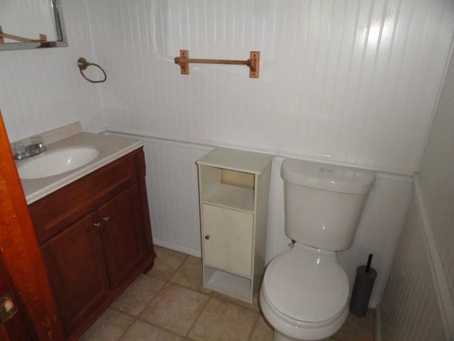 121 North Ridge Road Butler, PA 16001 - Photo 10 of 13 a bathroom with a toilet a sink and mirror