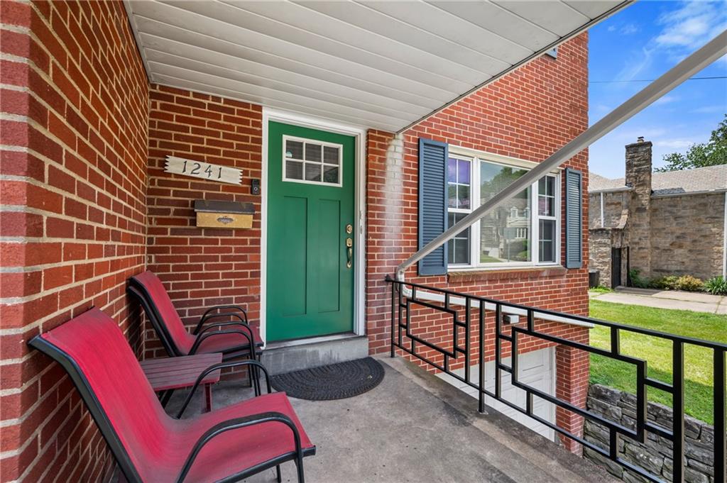 1241 Cochran Road Pittsburgh, PA 15243 - Photo 2 of 30 a view of balcony with two chairs and a barbeque