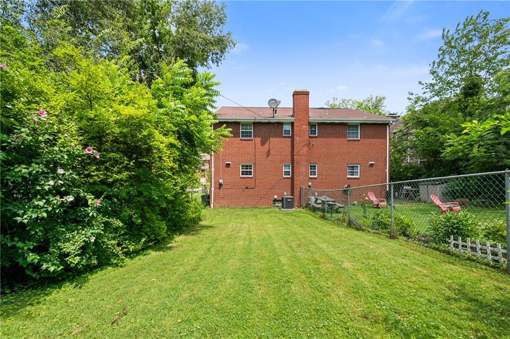 1241 Cochran Road Pittsburgh, PA 15243 - Photo 22 of 30 a view of a backyard with potted plants and large trees