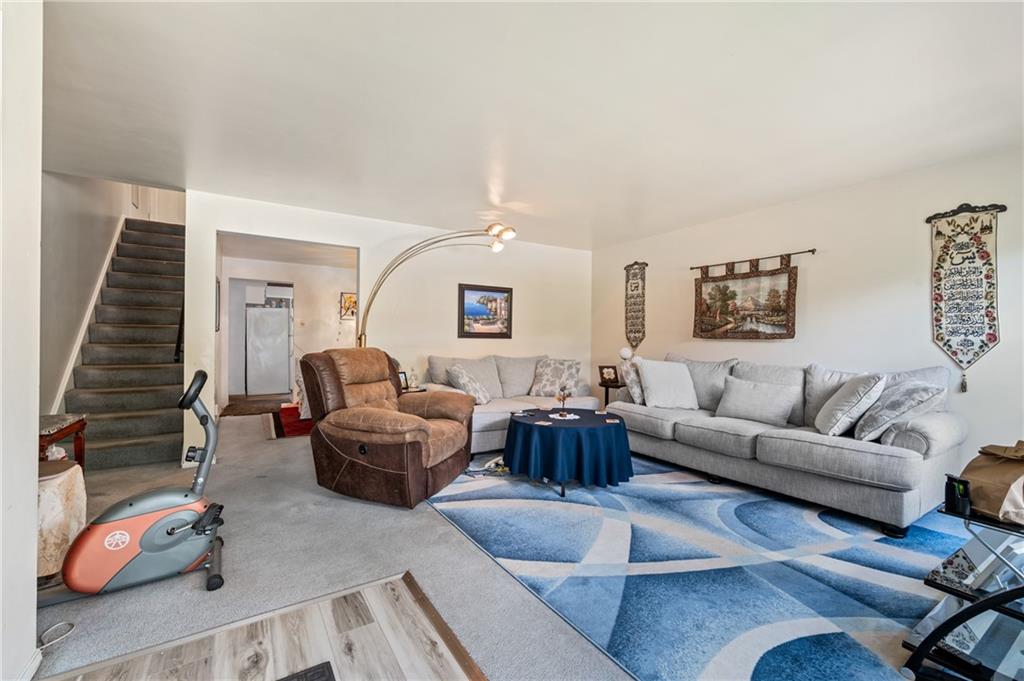 1241 Cochran Road Pittsburgh, PA 15243 - Photo 5 of 30 a living room with furniture and a potted plant
