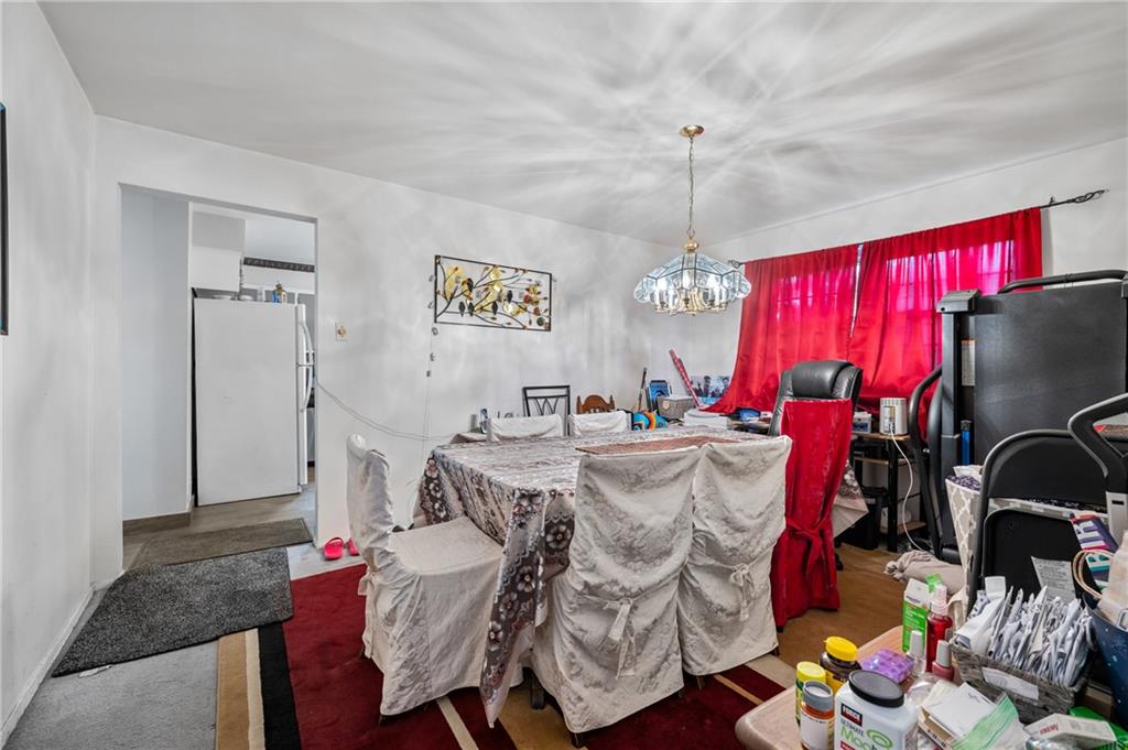 1241 Cochran Road Pittsburgh, PA 15243 - Photo 6 of 30 a living room with furniture and a chandelier