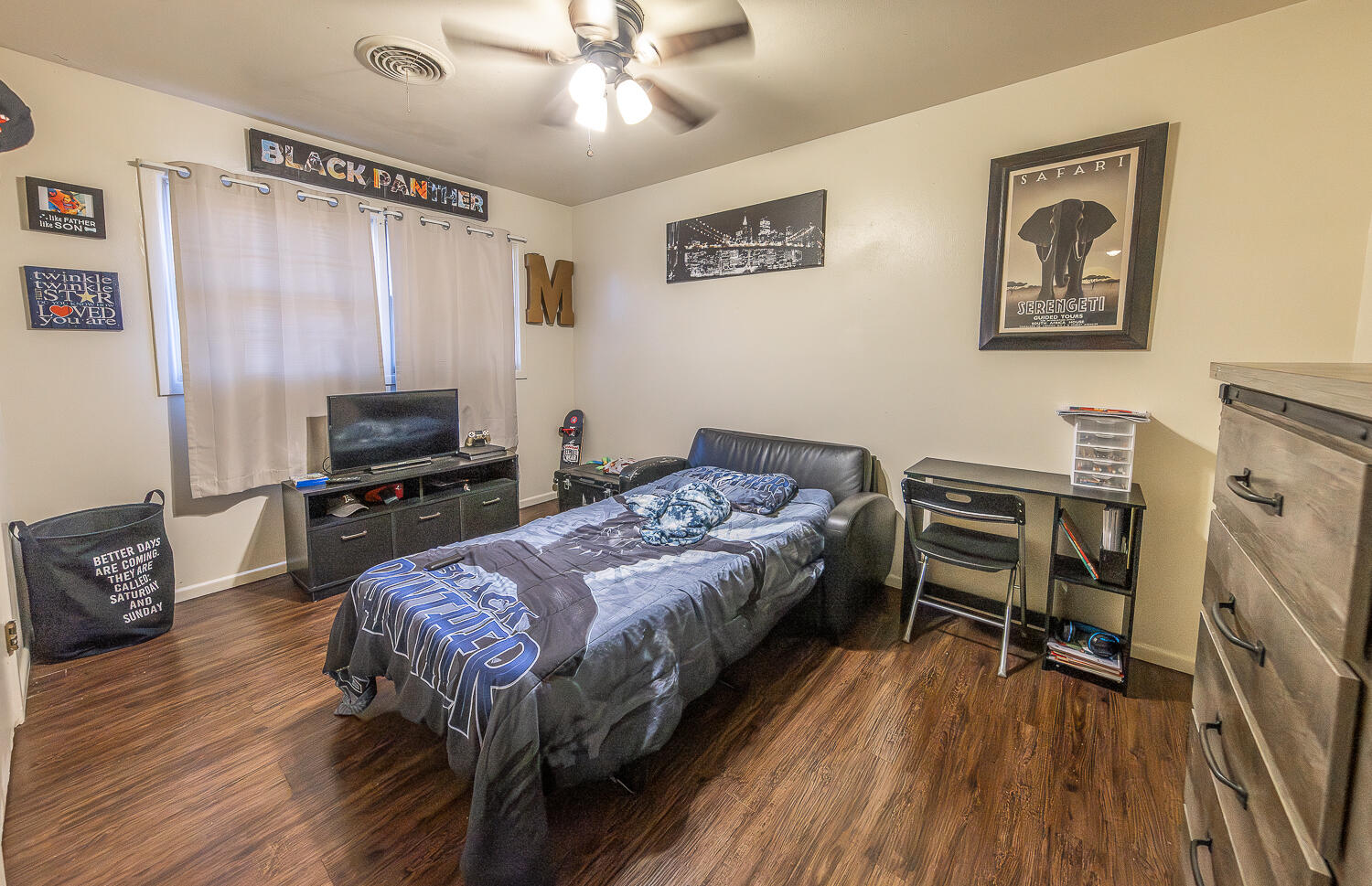 2412 33rd Street Lubbock, TX 79411 - Photo 11 of 34 a bedroom with a bed and furniture