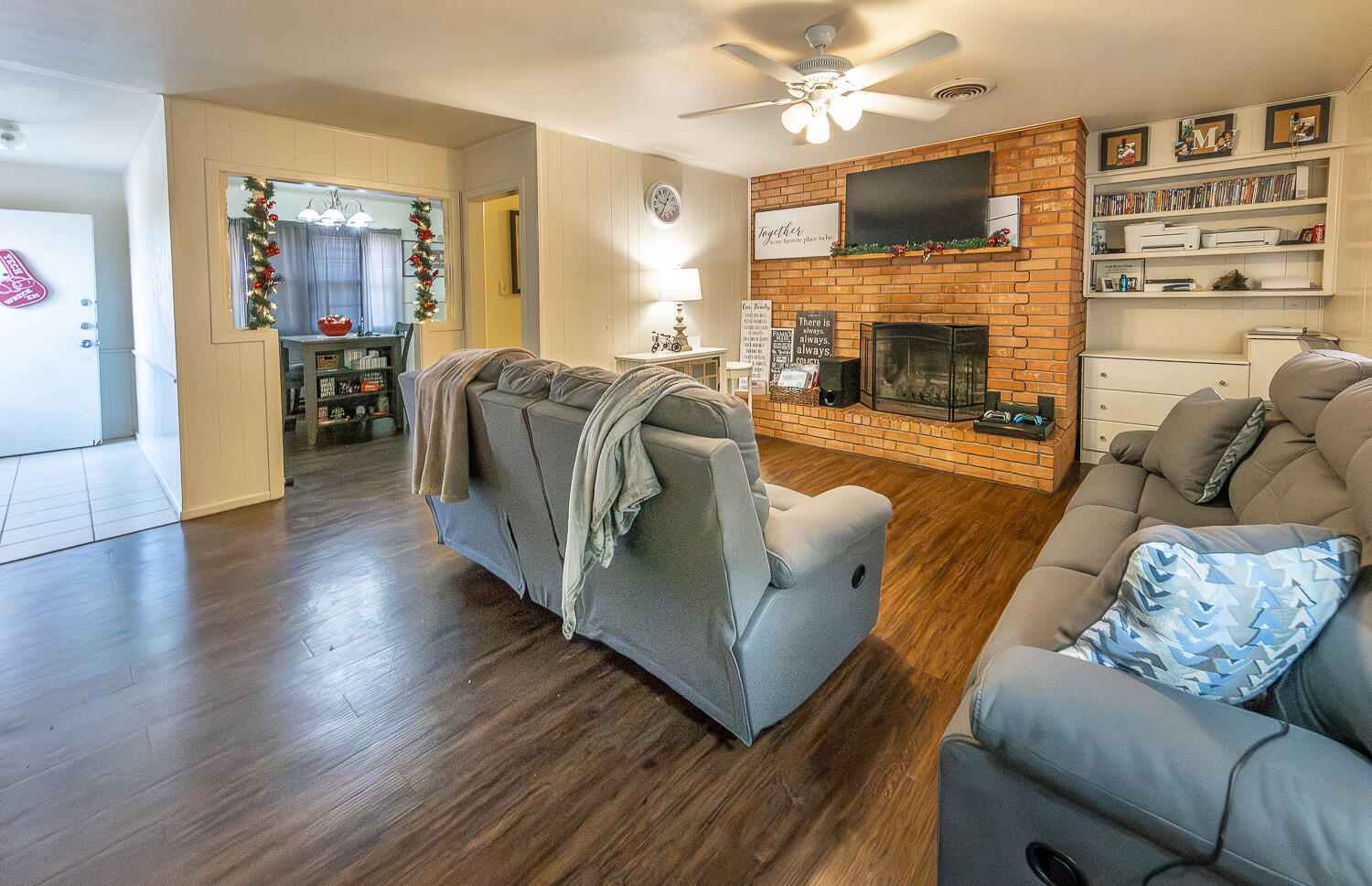 2412 33rd Street Lubbock, TX 79411 - Photo 2 of 34 a living room with furniture fireplace and flat screen tv
