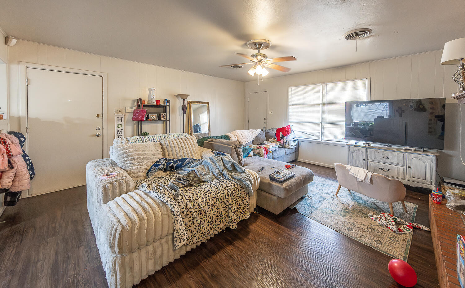 2412 33rd Street Lubbock, TX 79411 - Photo 21 of 34 a living room with furniture and a flat screen tv