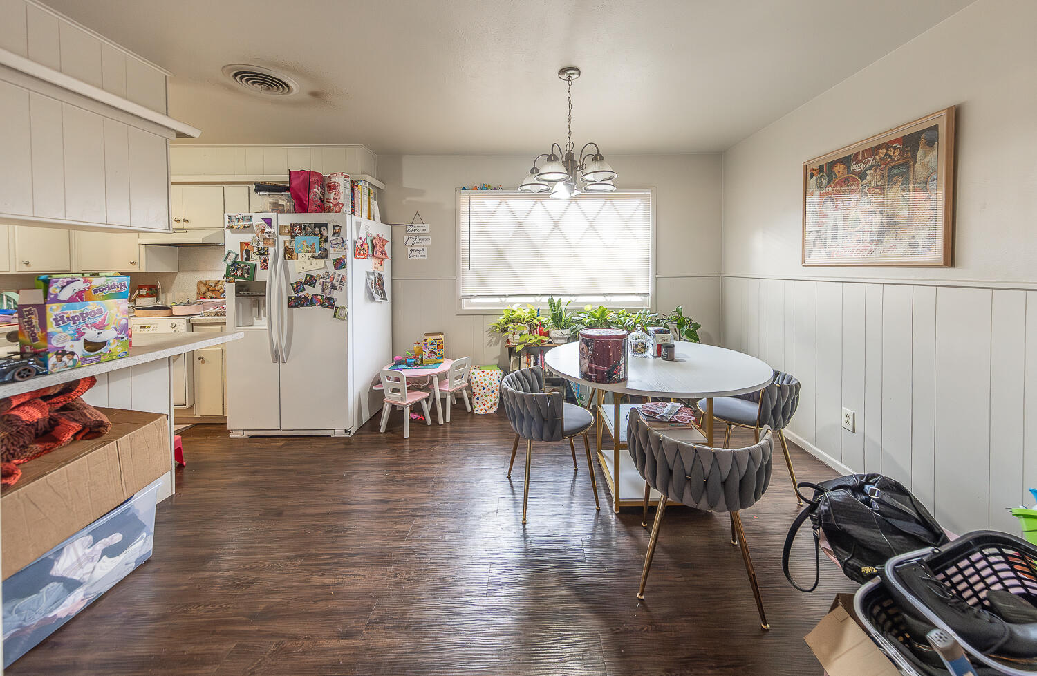 2412 33rd Street Lubbock, TX 79411 - Photo 22 of 34 a view of a dining room with furniture window and wooden floor
