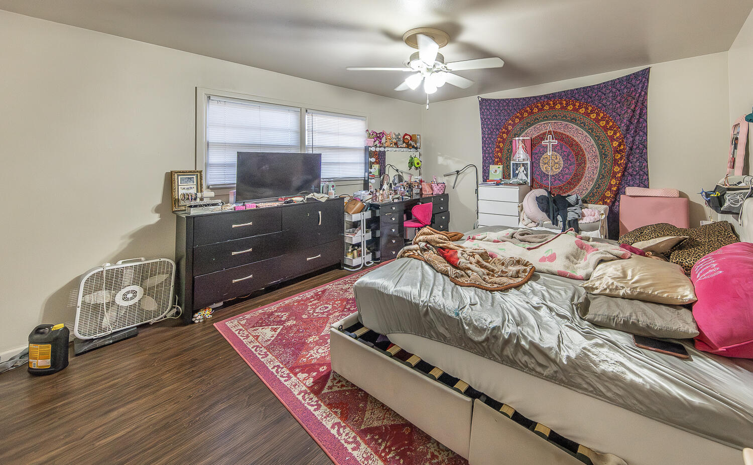 2412 33rd Street Lubbock, TX 79411 - Photo 27 of 34 a living room with furniture and a flat screen tv