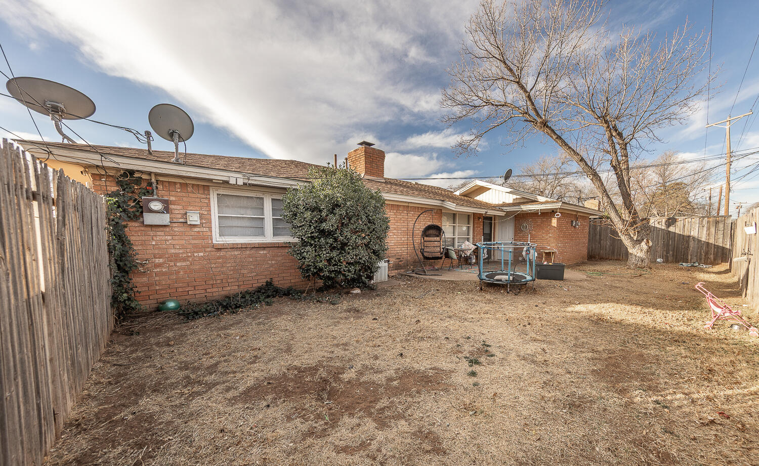 2412 33rd Street Lubbock, TX 79411 - Photo 33 of 34 a view of a house with a yard