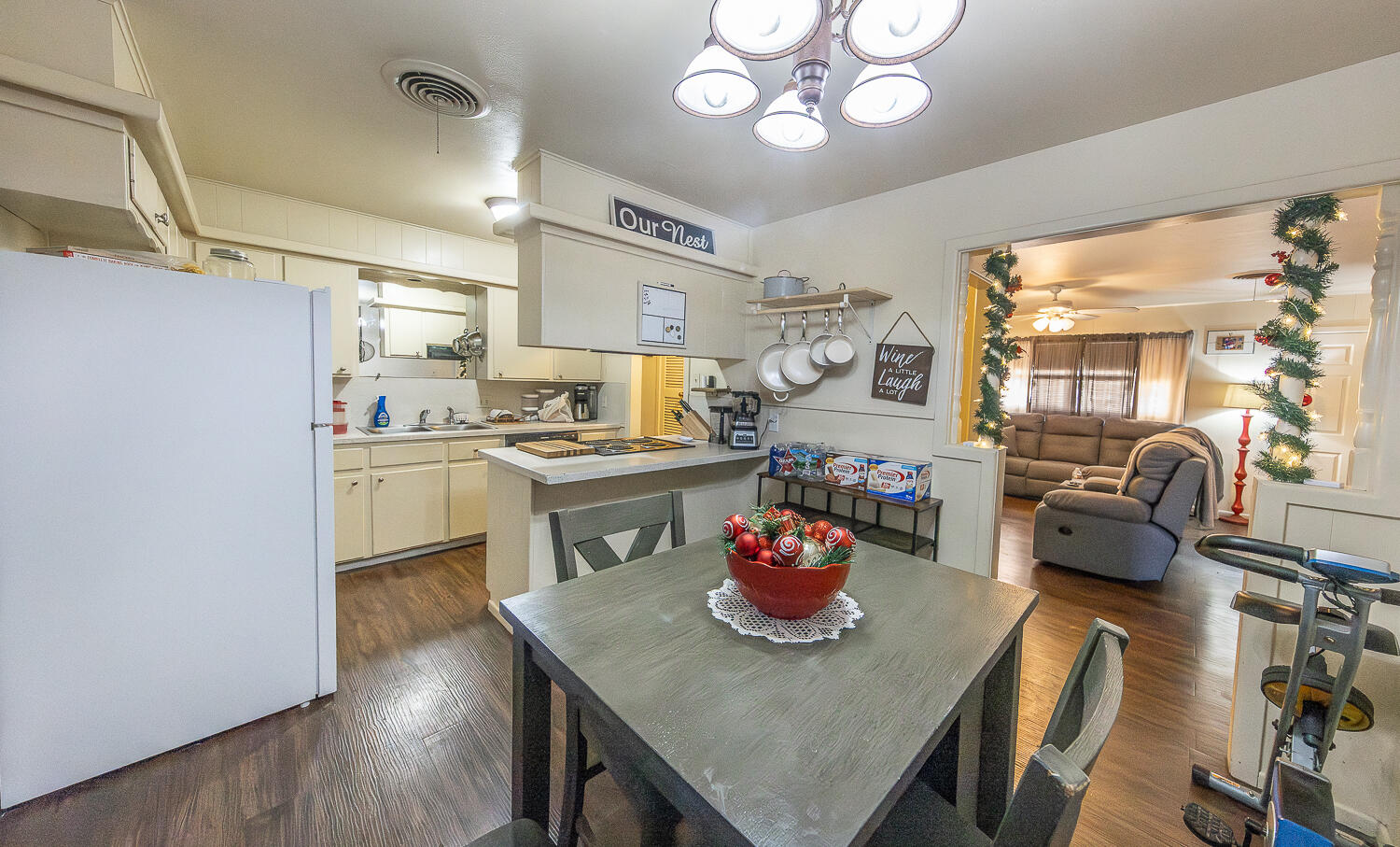 2412 33rd Street Lubbock, TX 79411 - Photo 8 of 34 a kitchen with a table chairs and cabinets