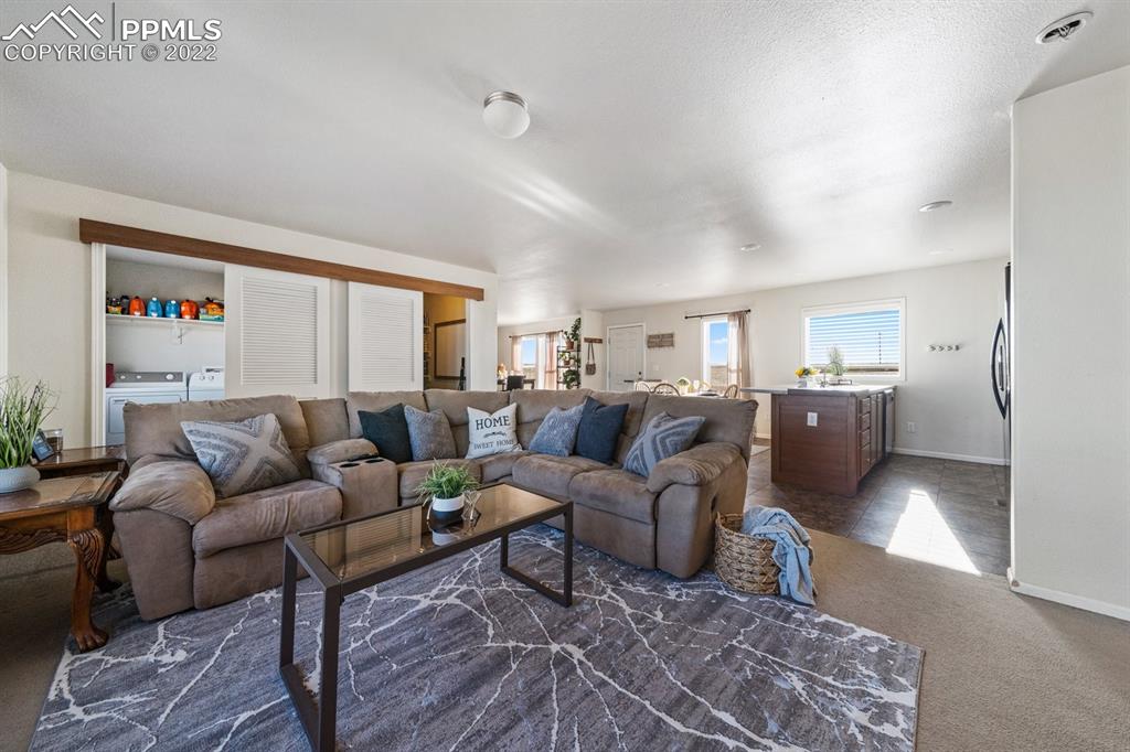 1305 North Ramah Highway Yoder, CO 80864 - Photo 15 of 30 a living room with furniture and a large window