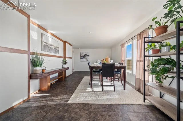 a view of a dining room with furniture window and outside view
