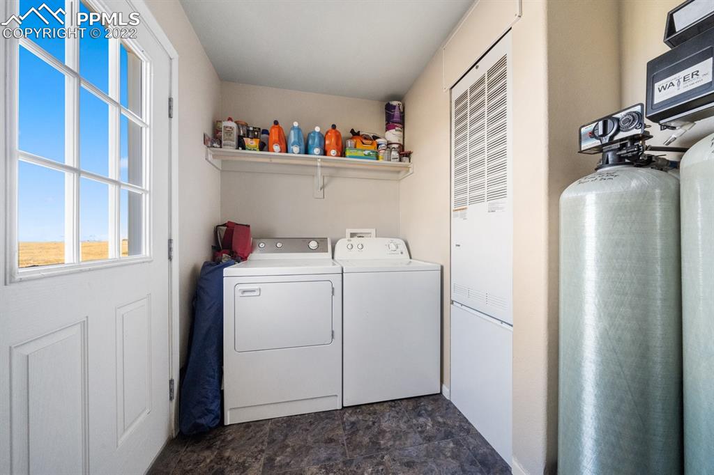 1305 North Ramah Highway Yoder, CO 80864 - Photo 23 of 30 a storage room with washer and dryer