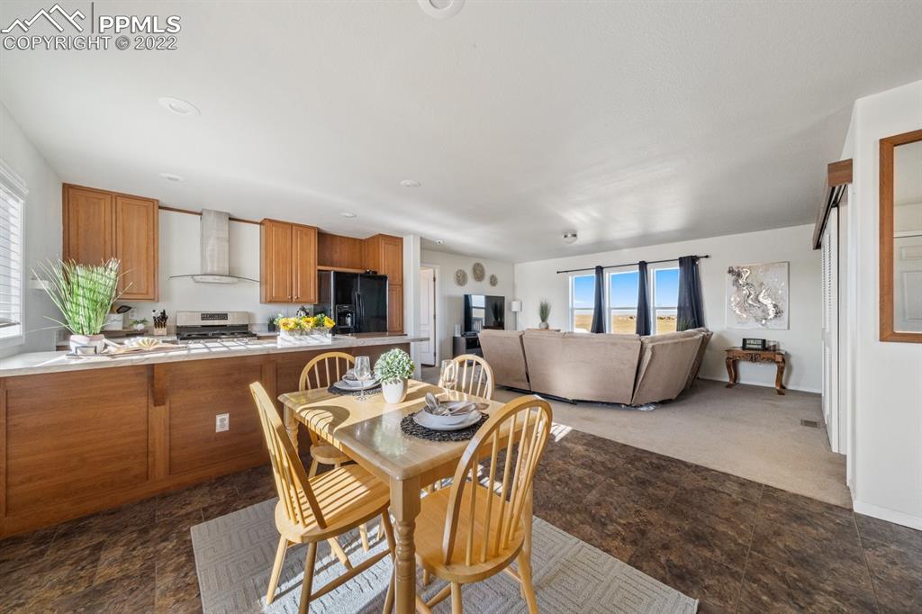 1305 North Ramah Highway Yoder, CO 80864 - Photo 4 of 30 a living room with furniture and a large window
