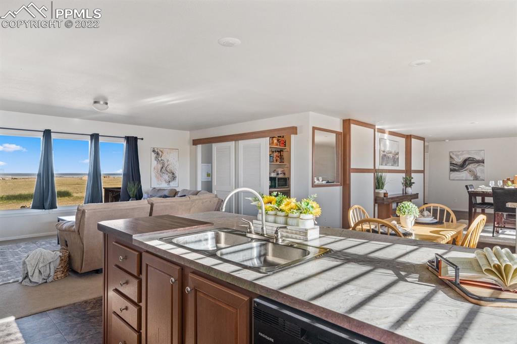 1305 North Ramah Highway Yoder, CO 80864 - Photo 5 of 30 a view of living room with granite countertop furniture and a fireplace