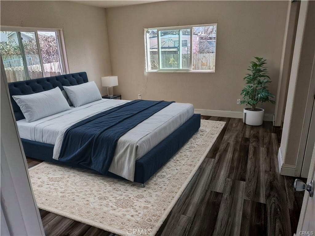 6029 1st Avenue Lucerne, CA 95458 - Photo 21 of 34 a bedroom with a bed and wooden floor