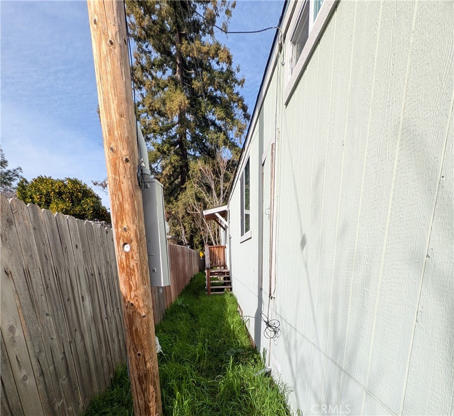 6029 1st Avenue Lucerne, CA 95458 - Photo 30 of 34 a view of a pathway of a house with wooden fence