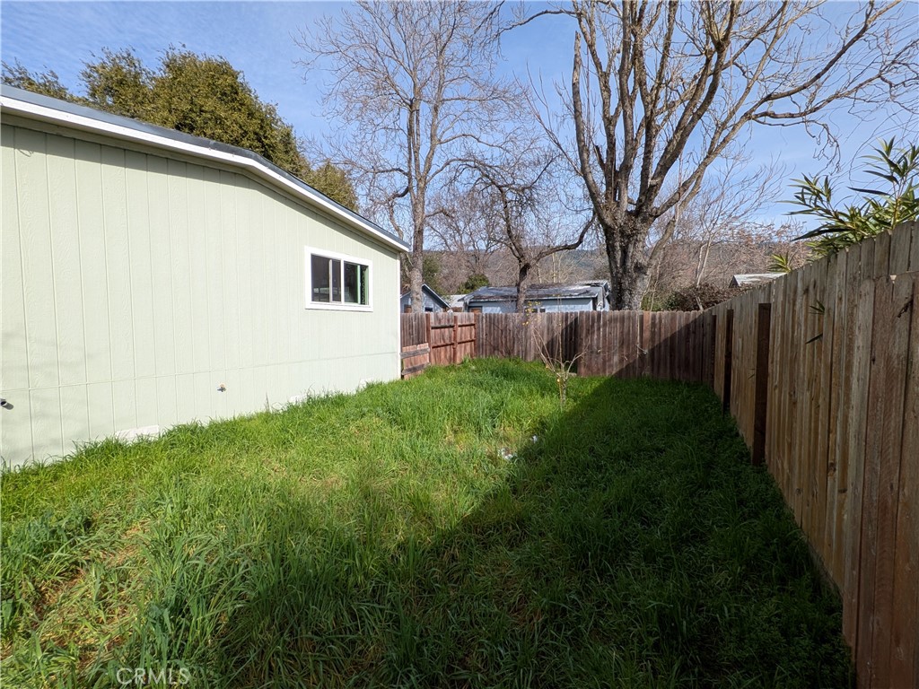 6029 1st Avenue Lucerne, CA 95458 - Photo 32 of 34 a backyard of a house with lots of green space
