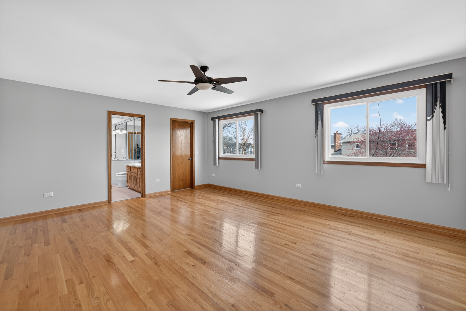 1281 Scarlet Drive Addison, IL 60101 - Photo 24 of 38 a view of an empty room with window and wooden floor