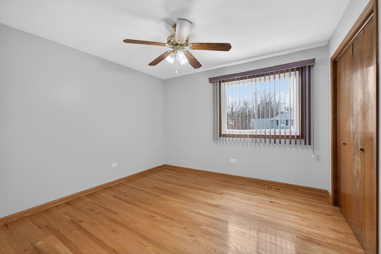 1281 Scarlet Drive Addison, IL 60101 - Photo 28 of 38 a view of empty room with wooden floor and fan