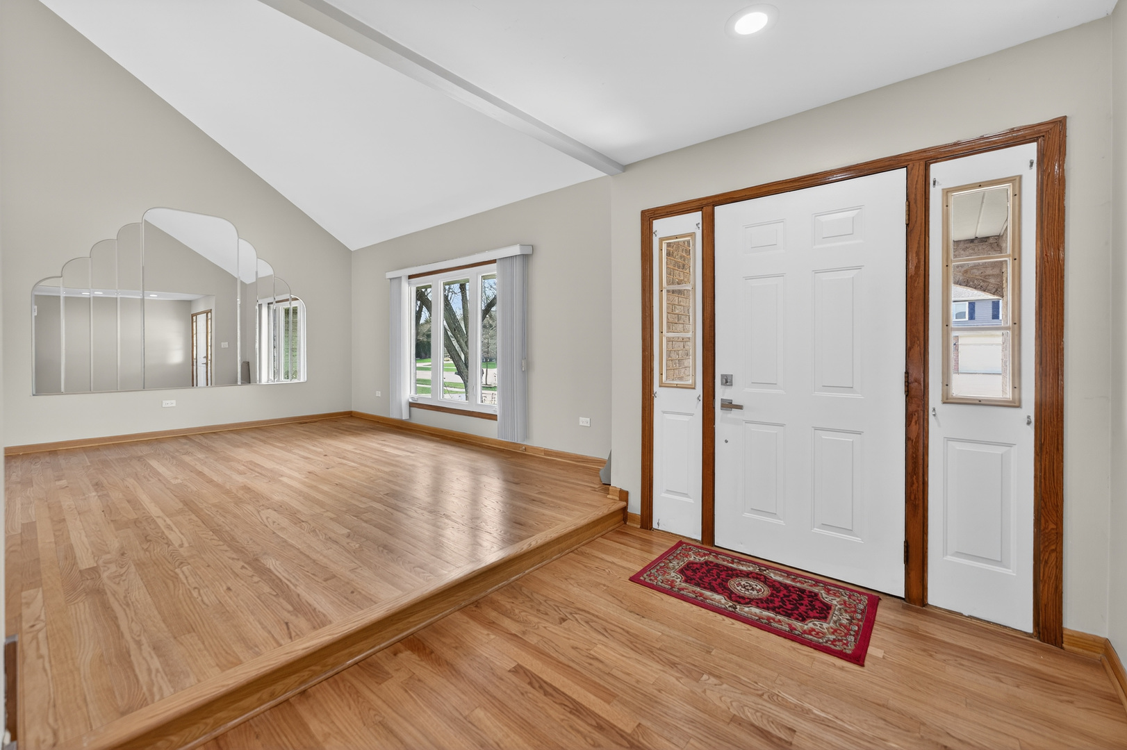 1281 Scarlet Drive Addison, IL 60101 - Photo 4 of 38 an empty room with wooden floor and windows