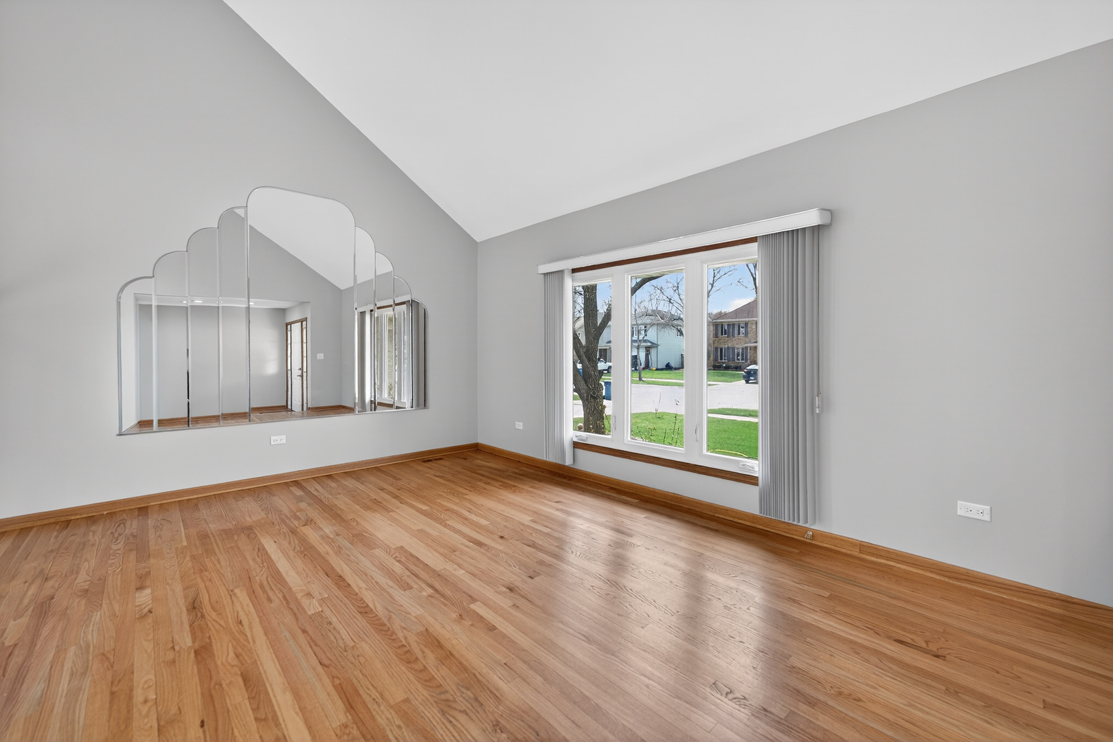1281 Scarlet Drive Addison, IL 60101 - Photo 6 of 38 a view of a big room with wooden floor and windows