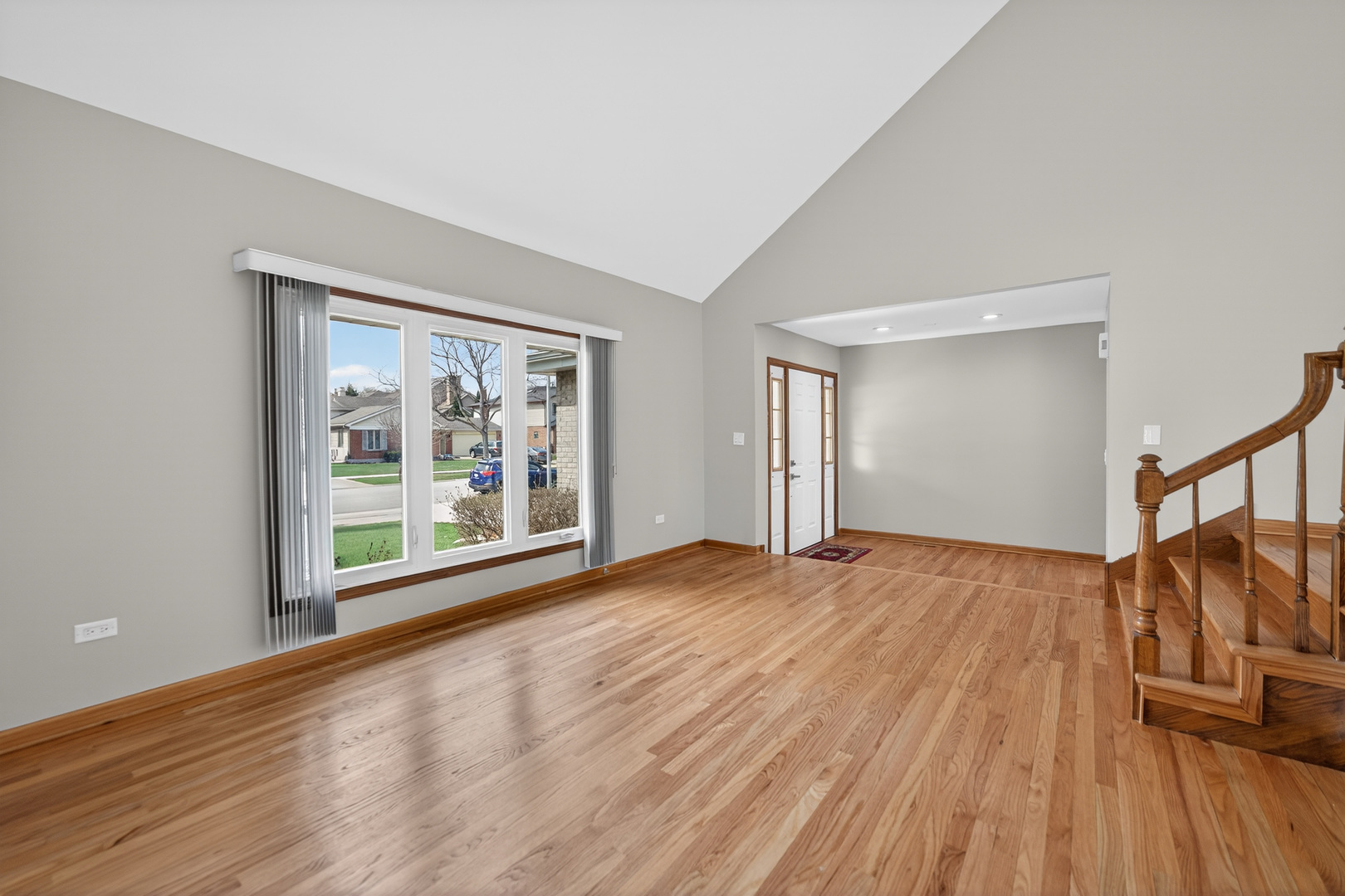 1281 Scarlet Drive Addison, IL 60101 - Photo 9 of 38 a view of empty room with wooden floor and fan