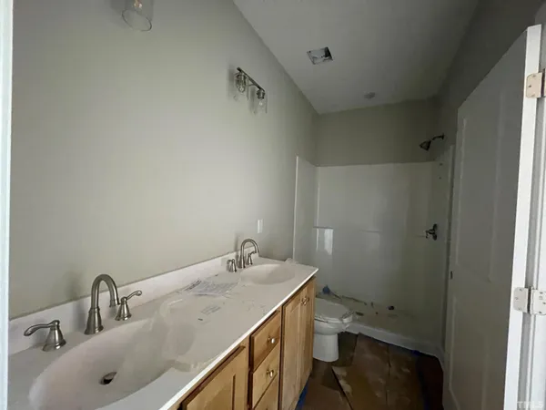 a bathroom with a sink and shower
