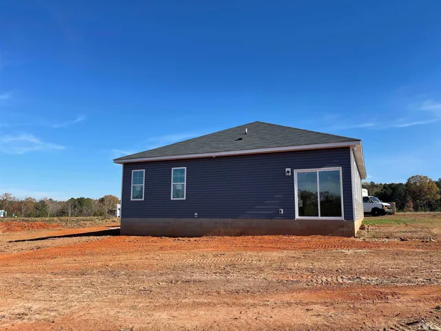 a sign that is sitting in front of a house