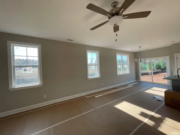 a kitchen with a sink a stove and cabinets