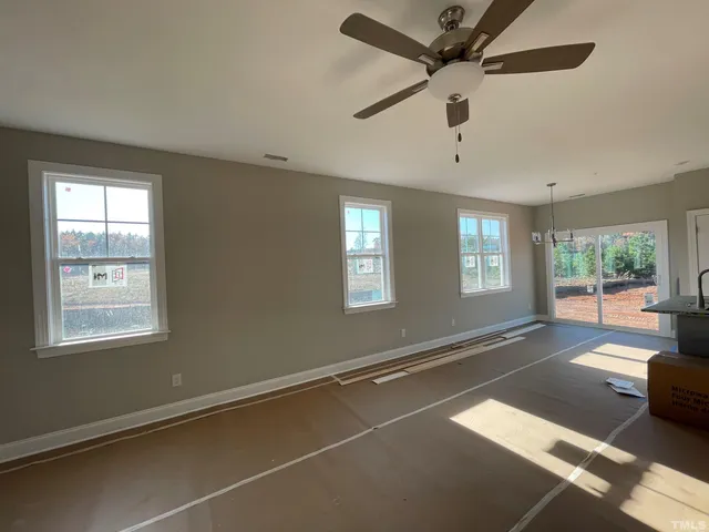 a kitchen with a sink a stove and cabinets